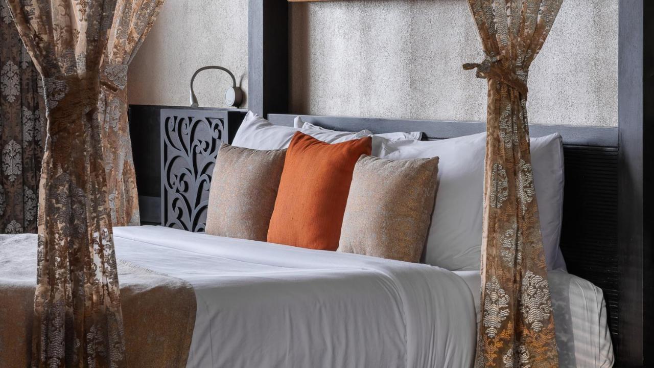 The Panoramic Getaway Hotel Munnar Luaran gambar A bed with cushions